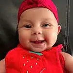Clothing, Nose, Face, Cheek, Skin, Head, Smile, Lip, Chin, Outerwear, Eyebrow, Eyes, Mouth, Facial Expression, Baby, Human Body, Baby & Toddler Clothing, Textile, Person, Joy, Headwear