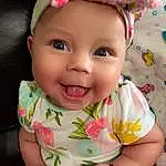 Clothing, Nose, Face, Smile, Cheek, Skin, Head, Lip, Chin, Eyes, Mouth, Baby & Toddler Clothing, Dress, Human Body, Sleeve, Textile, Iris, Happy, Pink, Baby, Person, Joy, Headwear