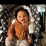 Smile, Comfort, Flash Photography, Happy, Baby Carriage, Toddler, Baby, Fun, Baby & Toddler Clothing, Baby Products, Sitting, Child, Leisure, Darkness, Pattern, Recreation, Car Seat, Portrait Photography, Laugh, Portrait, Person