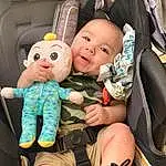 Leg, Smile, Toy, Comfort, Finger, Car Seat, Vroom Vroom, Happy, Fun, Thigh, Baby, Bag, Toddler, Child, Stuffed Toy, Luggage And Bags, Baby Products, Sitting, Family Car, Doll, Person
