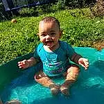 Water, Smile, Water Resources, Plant, Green, Happy, Grass, Toddler, Cool, Bathing, Leisure, Baby, Recreation, Fun, Child, Games, Inflatable, Swimming Pool, T-shirt, Play, Person, Joy