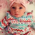 Face, Nose, Cheek, Skin, Head, Chin, Outerwear, White, Baby & Toddler Clothing, Baby, Textile, Sleeve, Pink, Toddler, Aqua, Pattern, Linens, Comfort, Child, T-shirt, Person, Headwear