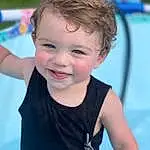 Water, Smile, Blue, Neck, Sleeve, Happy, Iris, Swimming Pool, Toddler, Leisure, Fun, Baby & Toddler Clothing, T-shirt, Recreation, Child, Chest, Bathing, Indoor Games And Sports, Vacation, Play, Person, Joy