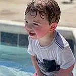 Skin, Smile, Water, Happy, Leisure, Toddler, Summer, Fun, Recreation, Baby & Toddler Clothing, T-shirt, Child, Grass, Sand, Sitting, Laugh, Swimming Pool, Personal Protective Equipment, Vacation, Play, Person