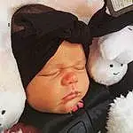 Nose, Cheek, Skin, Head, Lip, Mouth, White, Comfort, Textile, Baby Sleeping, Cap, Toy, Pink, Finger, Headgear, Baby, Toddler, Happy, Beauty