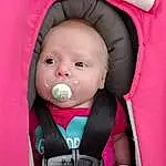 Face, Cheek, Skin, Eyes, Comfort, Baby Safety, Baby & Toddler Clothing, Baby Carriage, Pink, Iris, Baby, Toddler, Car Seat, Magenta, Fun, Baby Products, Auto Part, Seat Belt, Child, Person