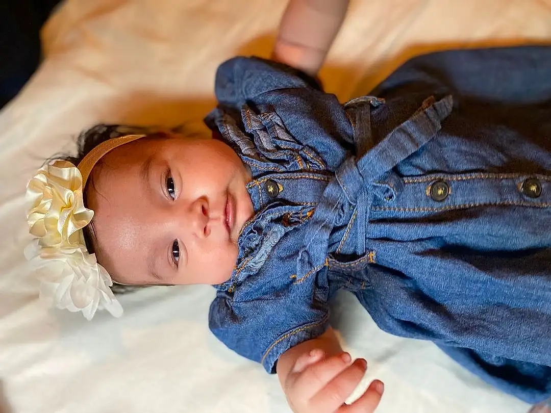 Skin, Head, Jeans, Smile, Facial Expression, Leg, Dress, Human Body, Plant, Textile, Sleeve, Baby & Toddler Clothing, Gesture, Happy, Finger, Wood, Tree, Toddler, Person, Headwear