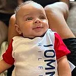 Smile, Cheek, Joint, Skin, Hand, Hairstyle, Arm, Facial Expression, Neck, Sleeve, Happy, Gesture, Baby & Toddler Clothing, Baby, Finger, Toddler, Person
