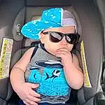 Glasses, Vision Care, Goggles, Arm, Mouth, Sunglasses, Blue, Automotive Design, Eyewear, Finger, Baby & Toddler Clothing, Hat, Cap, Cool, Baseball Cap, Vehicle Door, Toddler, T-shirt, Car Seat, Person, Headwear