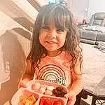 Smile, Food, Dress, Happy, Food Craving, Pink, Finger, Toddler, Summer, Ingredient, Shorts, Recipe, Cuisine, T-shirt, Dish, Child, Thigh, Chair, Event, Sweetness, Person, Joy