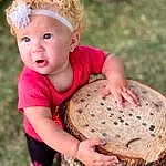 Face, Hair, Head, Hand, Hairstyle, Eyes, Photograph, Membranophone, People In Nature, Plant, Happy, Baby & Toddler Clothing, Wood, Finger, Grass, Toddler, Basket, Trunk, Fun, Child, Person, Headwear