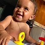 Face, Nose, Cheek, Skin, Head, Lip, Smile, Arm, Eyebrow, Mouth, Eyes, Facial Expression, Neck, Eyelash, Baby, Happy, Iris, Tooth, Baby Playing With Toys, Person