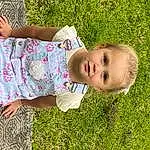 Clothing, Skin, People In Nature, Plant, Sleeve, Botany, Happy, Toddler, Grass, Thigh, Baby & Toddler Clothing, Leisure, Meadow, Fun, Human Leg, Lawn, Tree, Baby, Grassland, Person