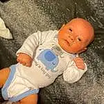Face, Nose, Cheek, Skin, Head, Eyes, Human Body, Sleeve, Baby & Toddler Clothing, Fun, Baby, Toy, Comfort, Toddler, Child, Sitting, Thigh, Stuffed Toy, Infant Bodysuit, Human Leg, Person