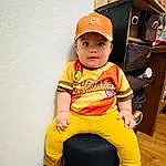 Shoe, Sleeve, Baby & Toddler Clothing, Cap, T-shirt, Happy, Sneakers, Toddler, Baby, Wood, Child, Fun, Knee, Baseball Cap, Sitting, Hardwood, Personal Protective Equipment, Room, Play, Person, Headwear