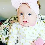 Face, Skin, Head, White, Baby & Toddler Clothing, Textile, Sleeve, Baby, Pink, Happy, Toddler, Costume Hat, Hat, Collar, Child, Pattern, Event, Linens, Fashion Accessory, Headpiece, Person, Headwear