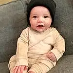 Face, Nose, Cheek, Skin, Head, Lip, Outerwear, Smile, Eyebrow, Eyes, Comfort, Sleeve, Baby, Baby & Toddler Clothing, Gesture, Flash Photography, Toddler, Wood, Happy, Person, Headwear