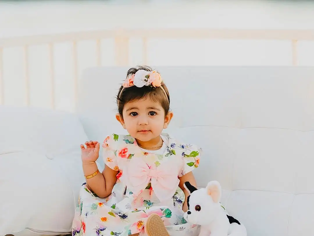 Dress, Sleeve, Flash Photography, Happy, Baby & Toddler Clothing, Toddler, Comfort, Baby, Sitting, Peach, Child, Grass, Pattern, Portrait Photography, Sock, Sweetness, Leisure, Furry friends, Photo Shoot, Person