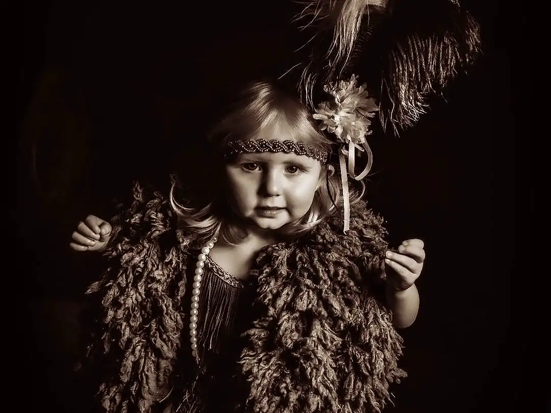 Flash Photography, Gesture, Happy, Entertainment, Long Hair, Art, Performing Arts, Fashion Design, Headpiece, Event, Darkness, Furry friends, Fashion Accessory, Feather, Toddler, Black & White, Still Life Photography, Visual Arts, Cg Artwork, Monochrome, Person
