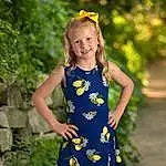 Face, Hair, Smile, Plant, One-piece Garment, People In Nature, Sleeve, Happy, Yellow, Dress, Day Dress, Grass, Summer, Waist, Electric Blue, Toddler, Blond, Baby & Toddler Clothing, Brown Hair, Pattern, Person, Joy