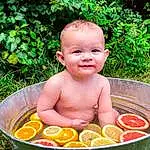 Plant, Smile, Nature, Green, Botany, Leaf, People In Nature, Grass, Happy, Toddler, Leisure, Fruit, Fun, Recreation, Baby, Baby Laughing, Garden, Child, Sitting, Baby Products, Person, Joy