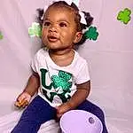 Face, Green, Sleeve, Happy, Baby & Toddler Clothing, Toddler, T-shirt, Child, Fun, Baby, Fashion Accessory, Jewellery, Play, Pattern, Shorts, Sitting, Person
