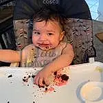 Cheek, Skin, Hairstyle, Food, Smile, Tableware, Pink, Plate, Baby, Toddler, Dishware, Fun, Child, Table, Baby & Toddler Clothing, Sitting, Event, Chair, Sweetness, Person
