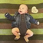 Face, Cheek, Leg, People In Nature, Baby & Toddler Clothing, Sleeve, Baby, Gesture, Finger, Toddler, Happy, Grass, Smile, Foot, Pattern, Fun, Sitting, Thumb, Person