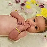 Cheek, Skin, Baby & Toddler Clothing, Baby, Happy, Pink, Finger, Toddler, Bathing, Fashion Accessory, Nail, Baby Products, Child, Foot, Stomach, Thumb, Petal, Hair Accessory, Chest, Baby Sleeping, Person