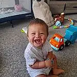 Head, Smile, Wheel, Toy, Tire, Wood, Toddler, Happy, Baby, Shorts, Baby & Toddler Clothing, T-shirt, Riding Toy, Fun, Child, Sitting, Foot, Play, Person, Joy