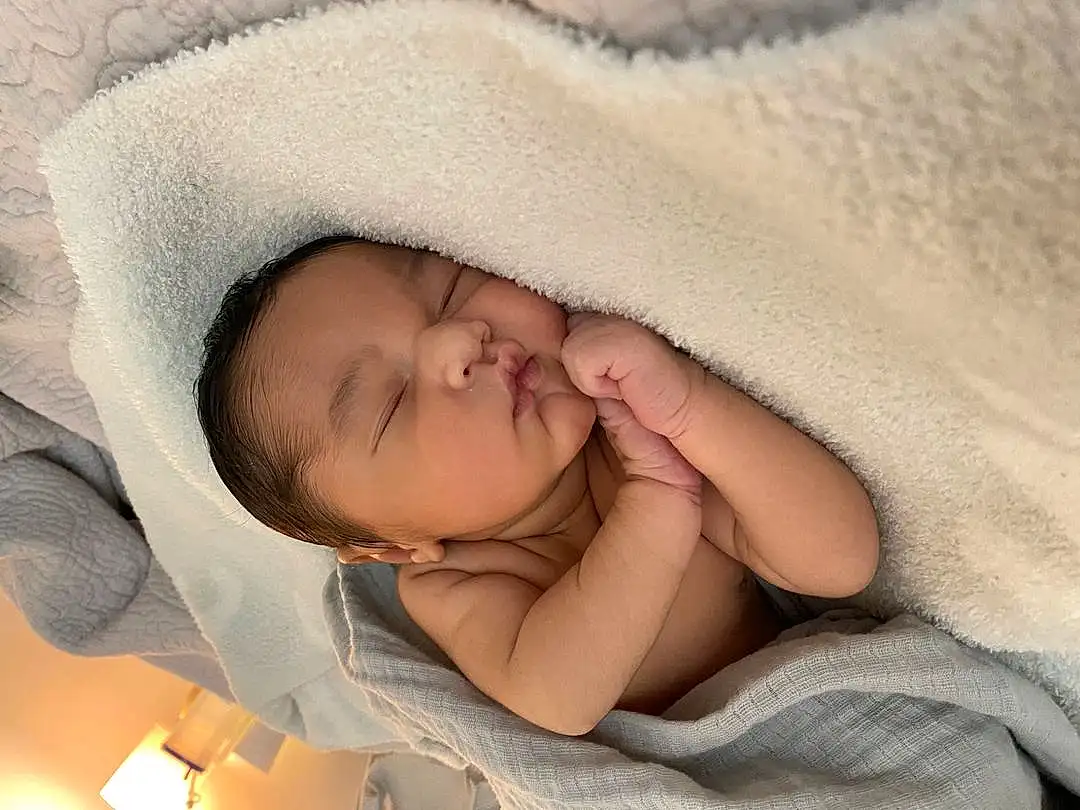 Nose, Cheek, Skin, Head, Eyebrow, Eyes, Comfort, Human Body, Baby Sleeping, Ear, Gesture, Eyelash, Baby, Linens, Toddler, Bed, Baby Products, Thumb, Bedding, Bedtime, Person