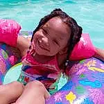 Water, Smile, Azure, Happy, Outdoor Recreation, Pink, Swimming Pool, Leisure, Recreation, Aqua, Toddler, Fun, Summer, Child, Personal Protective Equipment, Magenta, Games, Thigh, People In Nature, Event, Person, Joy