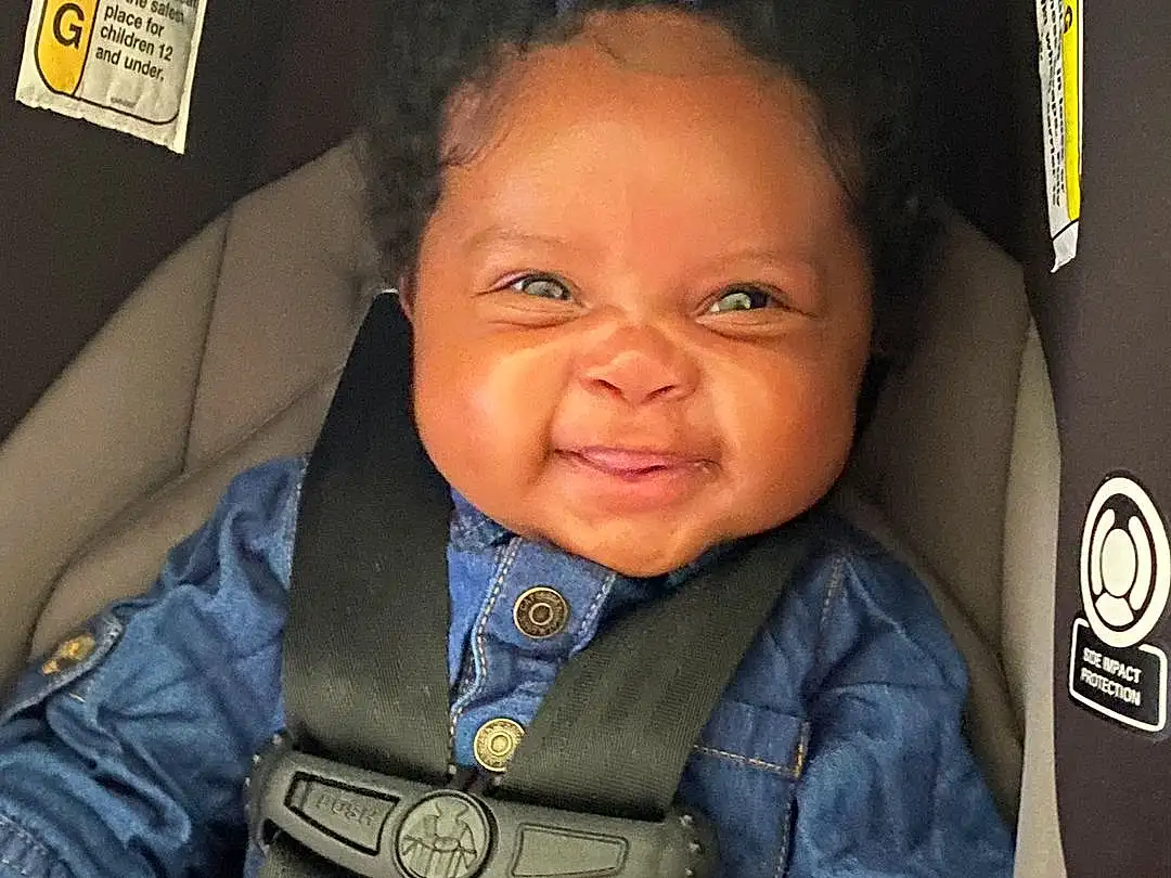 Nose, Cheek, Smile, Skin, Outerwear, Sleeve, Iris, Happy, Collar, Cool, People, Baby, Toddler, Comfort, Car Seat, Child, Electric Blue, Fun, Travel, Baby & Toddler Clothing, Person