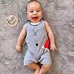 Face, Skin, Head, Smile, Baby & Toddler Clothing, Sleeve, Gesture, Dress, Baby, Happy, People In Nature, Toddler, T-shirt, One-piece Garment, Beauty, Pattern, Wood, Child, Fun, Person