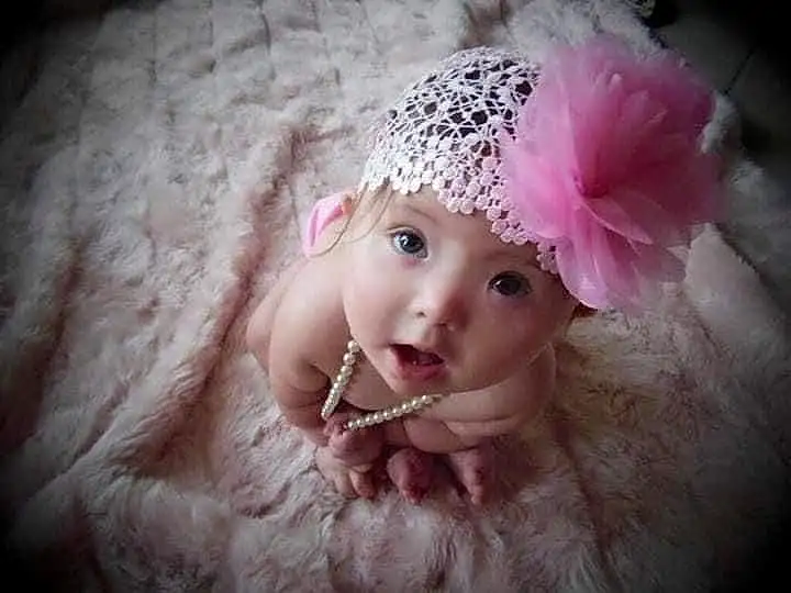 Lip, Cap, Flash Photography, Pink, Petal, Headgear, Costume Hat, Baby & Toddler Clothing, Happy, Headpiece, Magenta, Embellishment, Toddler, Baby, Hat, Hair Accessory, Fashion Accessory, Furry friends, Knit Cap, Child, Person, Headwear