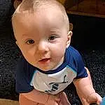 Cheek, Skin, Chin, Baby & Toddler Clothing, Baby, T-shirt, Toddler, Happy, Fun, Foot, Wood, Sitting, Electric Blue, Flash Photography, Barefoot, Baby Products, Child, Human Leg, Person