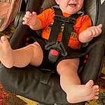 Arm, Comfort, Orange, Gesture, Lap, Thigh, Toddler, Shorts, Elbow, Knee, Personal Protective Equipment, Sitting, Car Seat, Grappling, Fun, Glove, Human Leg, Contact Sport, Sports Gear, Child, Person