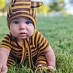 Face, Skin, Eyes, People In Nature, Plant, Baby & Toddler Clothing, Happy, Baby, Cap, Grass, Toddler, Grassland, Meadow, Fun, Child, Lawn, Wood, Pattern, Sitting, Person, Headwear