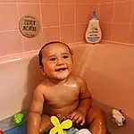Baby Bathing, Bathtub, Smile, Bathroom, Fluid, Personal Care, Bath Toy, Bathing, Toddler, Plumbing, Baby, Toy, Leisure, Thumb, Fun, Child, Room, Baby Products, Baby Playing With Toys, Happy, Person, Joy
