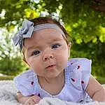 Skin, Lip, Happy, Baby & Toddler Clothing, Flash Photography, Plant, Baby, Tree, Grass, Toddler, People In Nature, Leisure, Child, Cap, Headband, Fashion Accessory, Sitting, Hair Accessory, Portrait Photography, Recreation, Person, Headwear