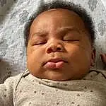 Face, Nose, Cheek, Skin, Head, Lip, Chin, Hand, Eyebrow, Eyes, Comfort, Baby & Toddler Clothing, Iris, Sleeve, Baby, Headgear, Toddler, Linens, Baby Sleeping, Bedtime, Person