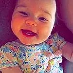 Face, Hair, Nose, Cheek, Skin, Head, Smile, Lip, Chin, Mouth, Arm, Eyes, Facial Expression, Neck, Baby & Toddler Clothing, Human Body, Purple, Sleeve, Person
