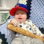 Smile, Outerwear, Cap, Textile, Sleeve, Headgear, Baby & Toddler Clothing, Baby, Happy, Toddler, Child, Costume Hat, Pattern, Fun, Fashion Accessory, Sitting, Baseball Cap, Linens, Fedora, Costume, Person, Headwear