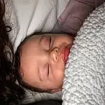 Nose, Cheek, Head, Lip, Eyes, Comfort, Eyelash, Textile, Flash Photography, Baby Sleeping, Linens, Toddler, Baby, Child, Close-up, Bedding, Bedtime, Furry friends, Room, Carmine, Person