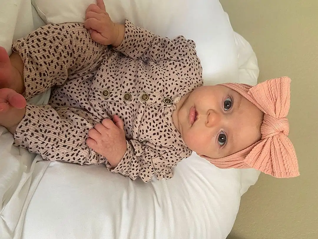Skin, Hand, Comfort, Human Body, Textile, Sleeve, Gesture, Finger, Baby & Toddler Clothing, Baby, Toddler, Baby Sleeping, Linens, Child, Hat, Room, Baby Products, Pattern, Nap, Sleep, Person, Headwear