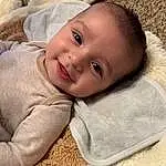 Face, Nose, Cheek, Skin, Head, Lip, Smile, Eyes, Comfort, Iris, Baby, Toddler, Happy, Grass, Baby & Toddler Clothing, Wood, Child, Close-up, Linens, Furry friends, Person, Joy