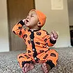 Face, Cheek, Baby & Toddler Clothing, Sleeve, Orange, Gesture, Happy, Collar, Baby, Toddler, Wood, Hat, Human Leg, Fun, Pattern, Sitting, Child, Thumb, Furry friends, Person, Headwear