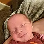 Face, Forehead, Nose, Cheek, Skin, Head, Lip, Chin, Eyebrow, Arm, Smile, Eyes, Mouth, Comfort, Human Body, Iris, Neck, Textile, Baby, Baby & Toddler Clothing, Person