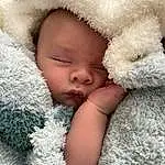 Face, Nose, Cheek, Skin, Head, Lip, Facial Expression, Comfort, Textile, Baby, Happy, Gesture, Iris, Baby & Toddler Clothing, Toddler, Baby Sleeping, Headgear, Cap, Person