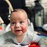 Cheek, Skin, Smile, Baby, Baby & Toddler Clothing, Happy, Toddler, Fun, Child, Sitting, Room, Event, Baby Products, T-shirt, Carmine, Portrait Photography, Leisure, Play, Person